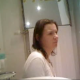 A girl is recorded pissing and shitting with a hidden camera in a bathroom. Pissing and shitting sounds are audible. Wiping can be seen, but no detailed poop action.